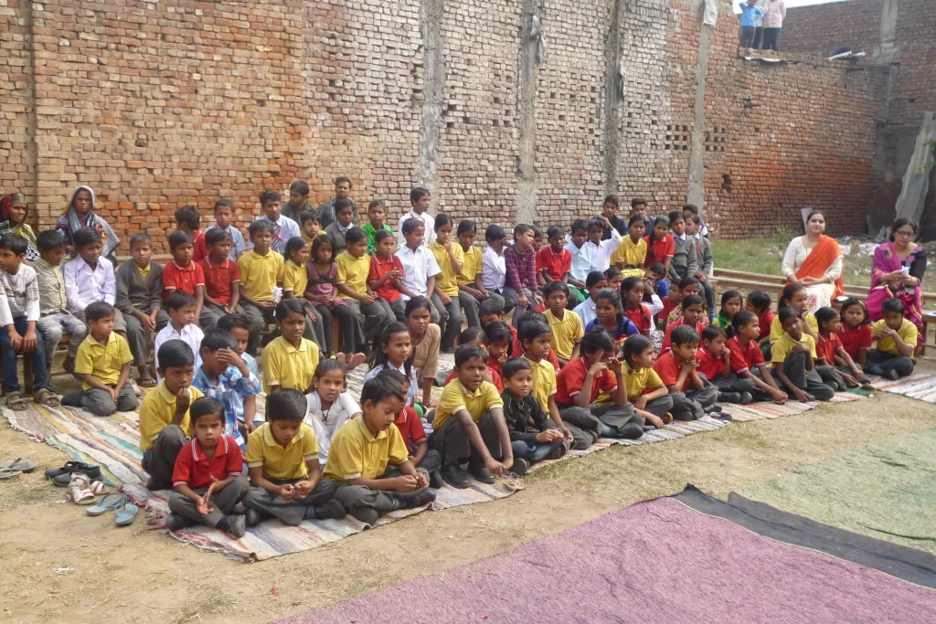 Students sitting outside Lakshya Trust Lakshya Paathshaala